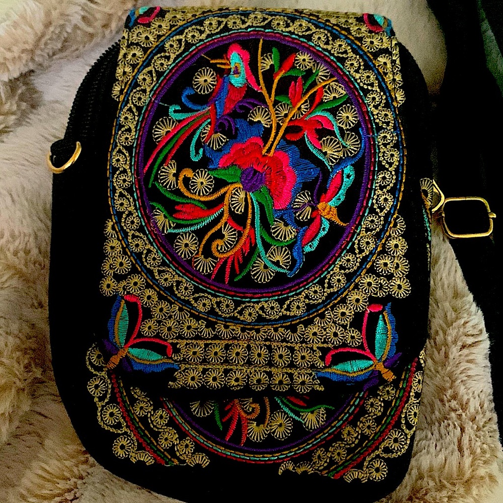 Small Embroidered aprox 6 inches with adjustable straps brand new with out tags